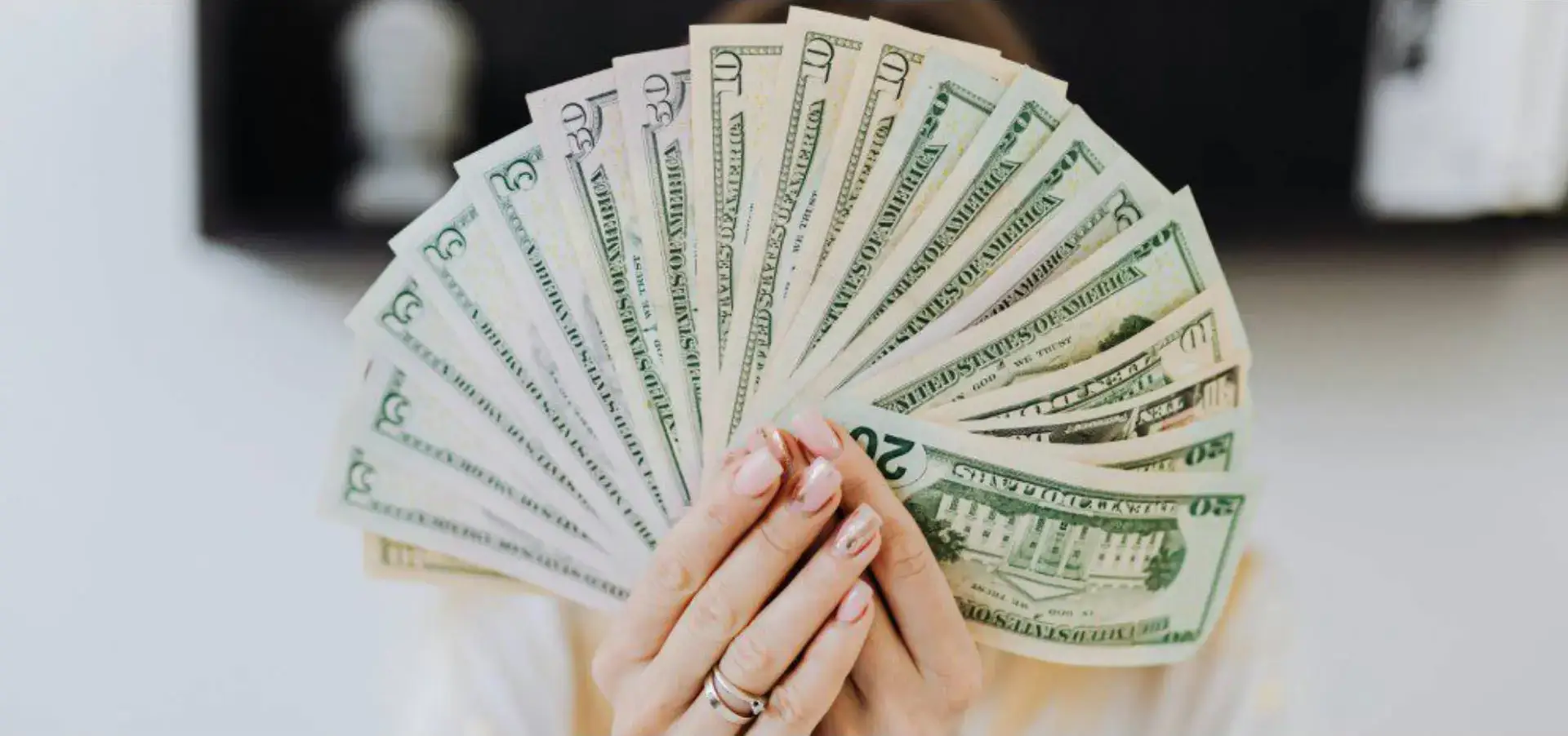 A woman holding money in her hands.